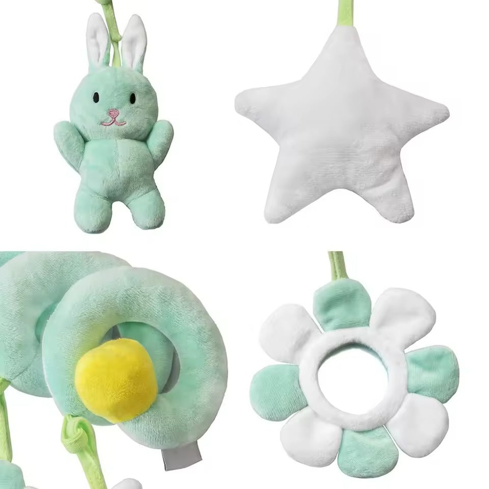 Set of soft toys including a bunny, star, caterpillar, and flower on a white background