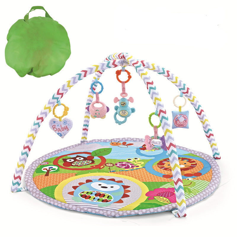 Colorful baby play gym with toys and a green bag on a white background