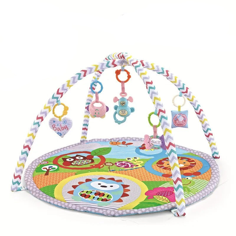 Colorful baby play gym with toys and a green bag on a white background